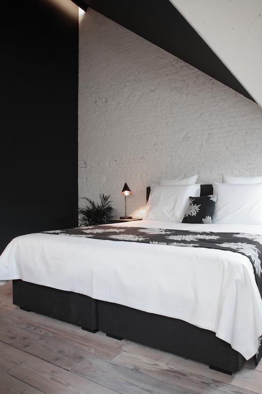 Maison Nationale City Flats & Suites Antwerpen Rom bilde A bedroom at the hotel